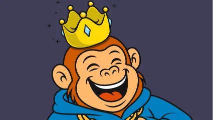 Apes head with a crown on while he laughs